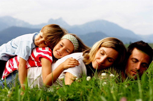 Young family resting in countryside